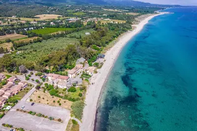 an aerial view of a beach and the ocean at Résidence hôtelière D'Amare in Cervione