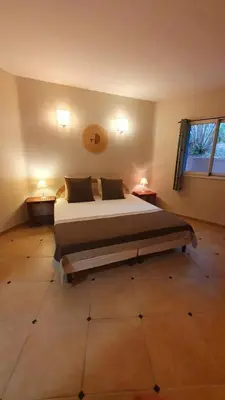 a bedroom with a large bed in a room at Villa eden blue F4 3 in Zonza