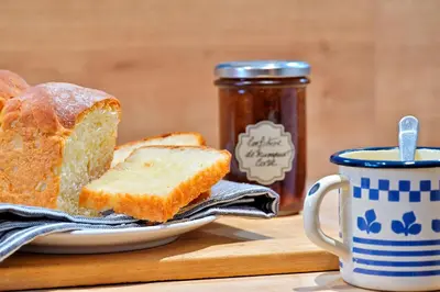 a plate with a slice of bread and a cup of coffee at Les bergeries alivaccia in Figari