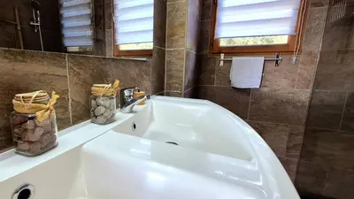 a bathroom with a large white bath tub at Appartement Ruscana, 4 pers, 90 m plage in Pinarellu