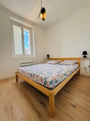 a bedroom with a bed in a room with a window at Straboni corte in Corte
