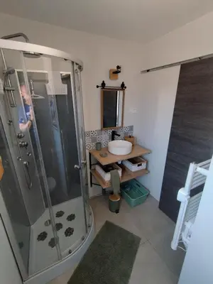 a bathroom with a shower and a sink at incore di u maquis corsu in Sotta
