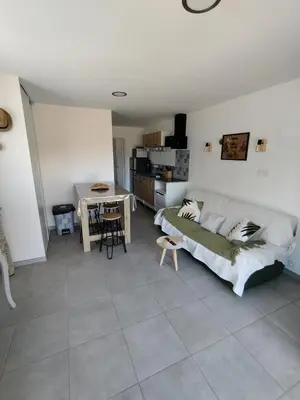 a living room with a couch and a table at incore di u maquis corsu in Sotta