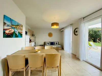 a kitchen and dining room with a table and chairs at BONIFACIO Villa U ARANCIU in Bonifacio