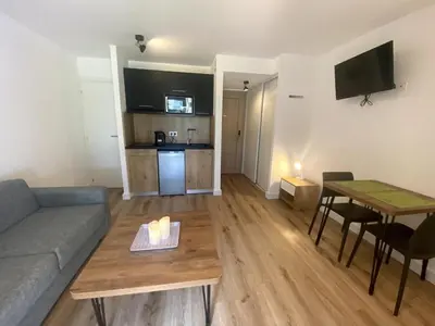 a living room with a couch and a table at Studio Corse entre mer et maquis cala rossa in Lecci