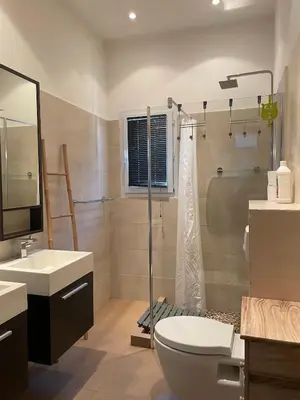 a bathroom with a shower and a toilet and a sink at Villa Jessy Porto-Vecchio in Porto-Vecchio