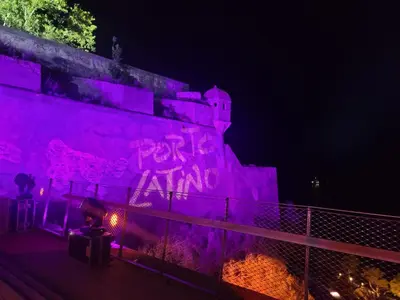 a wall with purple graffiti on it at night at Vos vacances à 3 minutes de la mer in Belgodère