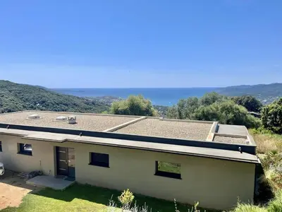 a view of a house with a roof at Villa d'architecte avec vue mer imprenable et piscine chauffée in Viggianello