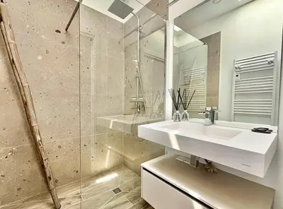 a white bathroom with a sink and a shower at Villa d'architecte avec vue mer imprenable et piscine chauffée in Viggianello