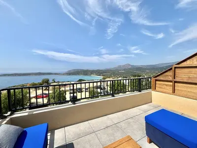 a balcony with a view of the water at Appartement Cargèse Théâtre de Verdure in Cargèse