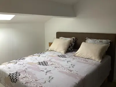 a bed with two pillows and a blanket on it at Saleccia in Santa-Lucia-di-Moriani