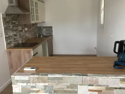 a kitchen with a wooden counter top in a room at Saleccia in Santa-Lucia-di-Moriani
