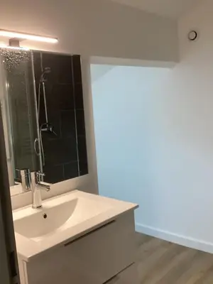 a bathroom with a sink and a mirror at Saleccia in Santa-Lucia-di-Moriani