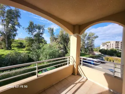 a balcony with a view of a street at T3 Vue mer bord de mer in Albitreccia