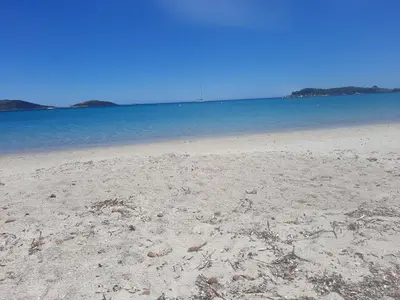 a sandy beach with the ocean in the background at Mini villa a 300m de la plage in Zonza