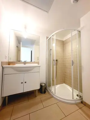 a bathroom with a sink and a shower at 4-6 couchages vue mer et port de Solenzara Corse in Sari Solenzara