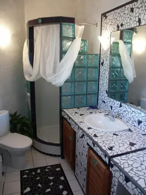 a bathroom with a sink and a toilet at BLU DI MARE Palombaggia in Porto-Vecchio