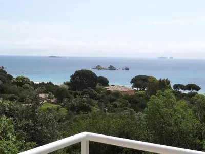 a view of the ocean from the balcony of a house at BLU DI MARE Palombaggia in Porto-Vecchio