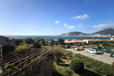 a view of the ocean from a house at Bright apartment 3 minutes from the beach in Ajaccio