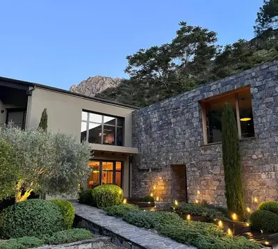 a stone house with lights in front of it at Dominique Colonna in Corte