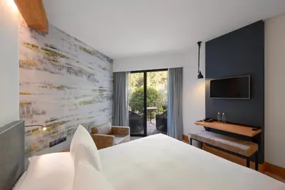 a hotel room with a bed and a desk at Dominique Colonna in Corte