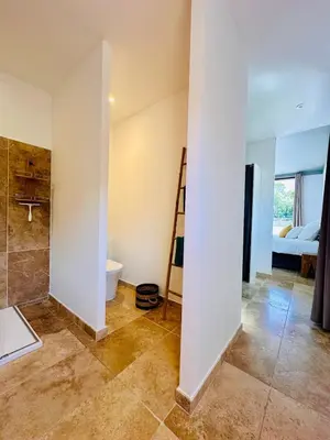 a bathroom with a shower and a toilet at Villa Dina - Douceur et calme in Bonifacio