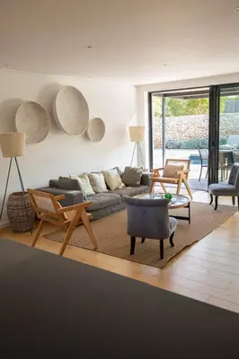 a living room with a couch and chairs at Villa Gioia- Charme et sérénité in Bonifacio