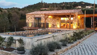 a villa with a view of a house at Casa PETRA et FIORI, une bergerie en pierres authentiques toute équipée - 4 personnes in Pietrosella