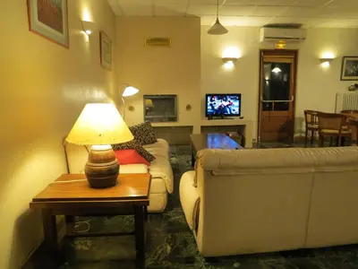 a restaurant with a table and chairs and a bar at Auberge - Hotel U Paradisu in Vico