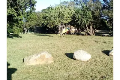 two rocks in a field with trees in the background at Villa climatisée, superbe vue mer in Ventiseri
