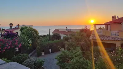 a view of a sunset from a house at LA PALGE Le Centuri in Linguizzetta