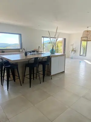 a large kitchen with a large table and chairs at Haut de Villa - Corsica in Lecci