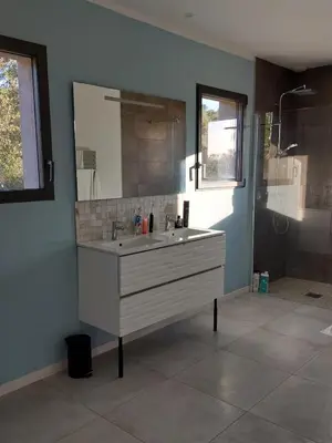 a bathroom with a white sink and a shower at Haut de Villa - Corsica in Lecci