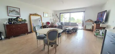 a living room with a table and chairs and a couch at T3 vue mer proche plage in Ajaccio