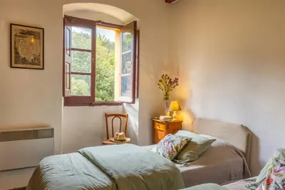 a bedroom with a bed and a window at Casa Di Babbo in Olmi-Cappella