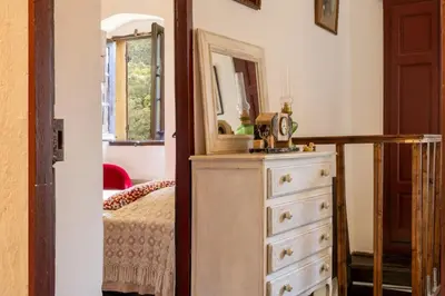a bedroom with a dresser and a mirror at Casa Di Babbo in Olmi-Cappella
