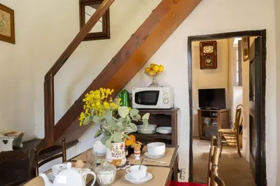 a dining room with a table with flowers on it at Casa Di Babbo in Olmi-Cappella
