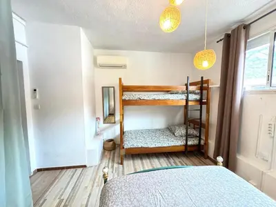 a bedroom with two bunk beds in a room at Fiori di sperenza in Coggia