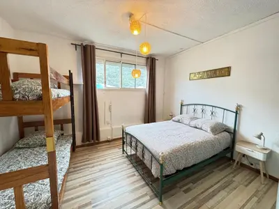 a bedroom with two bunk beds and a ladder at Fiori di sperenza in Coggia