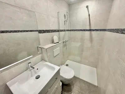 a bathroom with a sink and a toilet and a shower at Villa Porto- Vecchio avec piscine 8 pers in Lecci