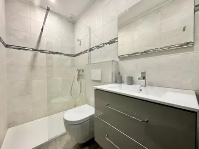 a bathroom with a sink and a toilet and a shower at Villa Porto- Vecchio avec piscine 8 pers in Lecci