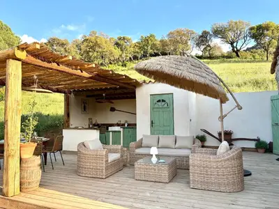 a living room with a couch and a coffee table at Tradition Corse & Modernité I Caseddi di Barabè in Granace