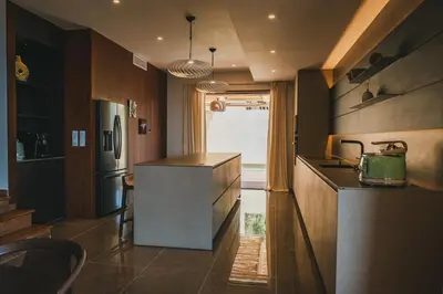 a kitchen with a counter top and a refrigerator at Casi di Mare in Cargèse
