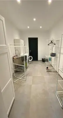 a room with white walls and a black door at Casa Culomba in Morta