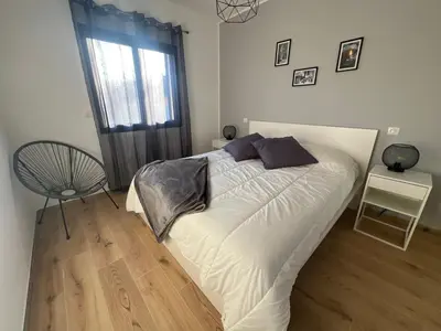 a bed in a bedroom with a window and a chair at Casa Culomba in Morta