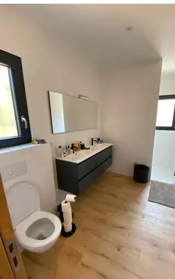 a bathroom with a white toilet and a sink at Casa Culomba in Morta