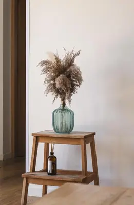 a vase with a plant in it on a table at Villa de standing Fiurenza - Domaine Romella - Piscine - Proche Saint-Florent in Oletta