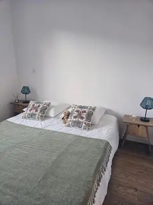 a bedroom with a bed with two teddy bears on it at Villa de standing Fiurenza - Domaine Romella - Piscine - Proche Saint-Florent in Oletta