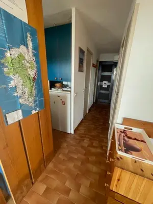 a hallway with a room with a map on the wall at Bella Vista 4, T2 vue mer, piscine, climatisé Porticcio in Porticcio