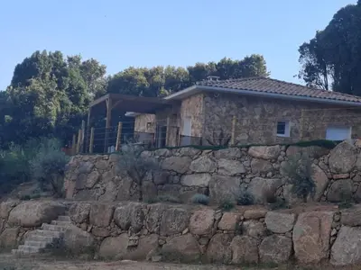 a house on top of a stone wall at Domaine Le Chemin des Oliviers jusqu'à 12 personnes piscine et ou jacuzzi in Ocana